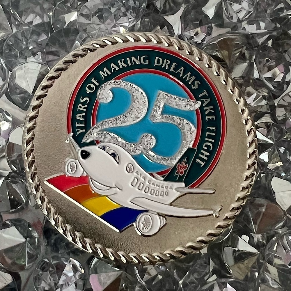 Disneyland coin 25th Anniversar airplane making dreams take flight air Canada